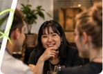 A guest enjoying a conversation over coffee